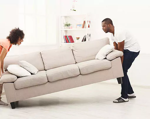 two people moving couch | Select Floors