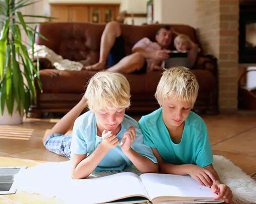 two children reading on tile floor | Select Floors