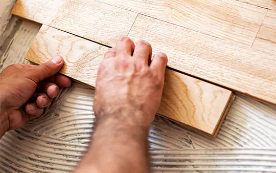 hardwood plank being installed | Select Floors