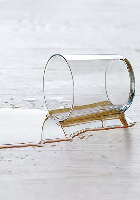 glass of liquid spilled on laminate | Select Floors