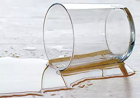 laminate spill glass of liquid spilled on laminate | Select Floors